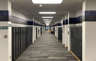 Painted lockers in a school, highlighting the smooth and durable finish achieved through electrostatic painting. Best paint colors for schools.