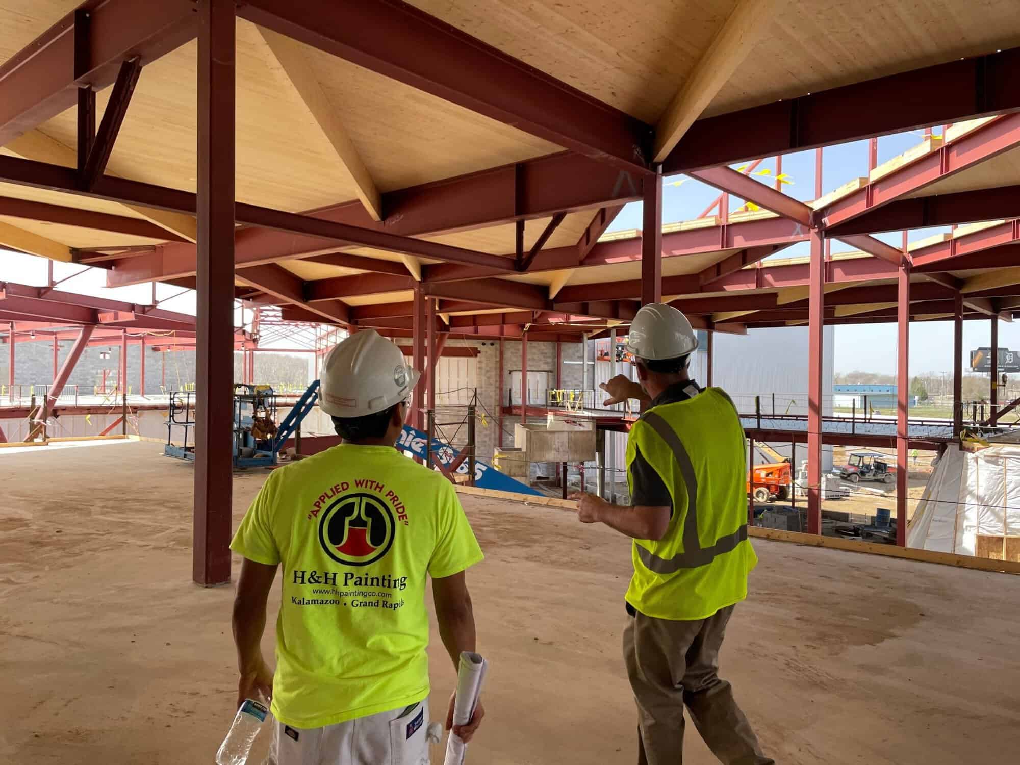 Job Walk H&H Painting job walk with the project team beneath exposed structural steel and mass timber at the KRESA Career Connect Campus